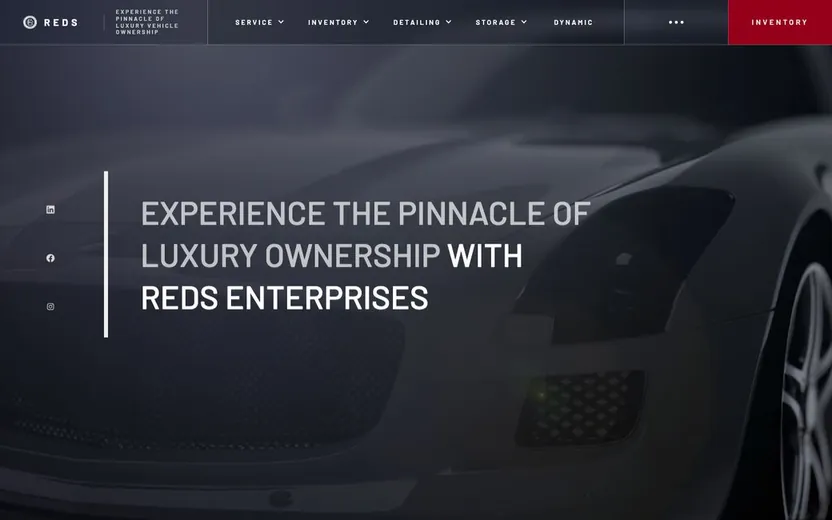 Reds Enterprises homepage, uppercase headline over a dark luxury car close-up